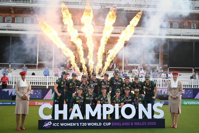 Australia celebrate with the trophy after the ICC Women's T20 cricket world cup 2026 final between Australia and England, at Lord's in London on July 5, 2026. Australia thrashed England by seven wickets to win the Women's T20 World Cup final at Lord's on Sunday. Victory gave Australia a record-extending seventh Women's T20 global title as they chased down a target of 151 with 17 balls to spare. (Photo by JUSTIN TALLIS / AFP)