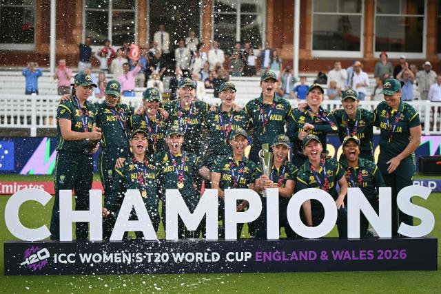 Australia celebrate with the trophy after the ICC Women's T20 cricket world cup 2026 final between Australia and England, at Lord's in London on July 5, 2026. Australia thrashed England by seven wickets to win the Women's T20 World Cup final at Lord's on Sunday. Victory gave Australia a record-extending seventh Women's T20 global title as they chased down a target of 151 with 17 balls to spare. (Photo by JUSTIN TALLIS / AFP)