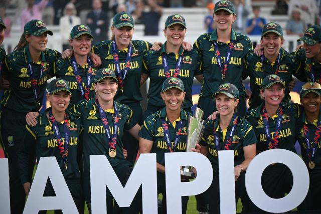Australia celebrate with the trophy after the ICC Women's T20 cricket world cup 2026 final between Australia and England, at Lord's in London on July 5, 2026. Australia thrashed England by seven wickets to win the Women's T20 World Cup final at Lord's on Sunday. Victory gave Australia a record-extending seventh Women's T20 global title as they chased down a target of 151 with 17 balls to spare. (Photo by JUSTIN TALLIS / AFP)