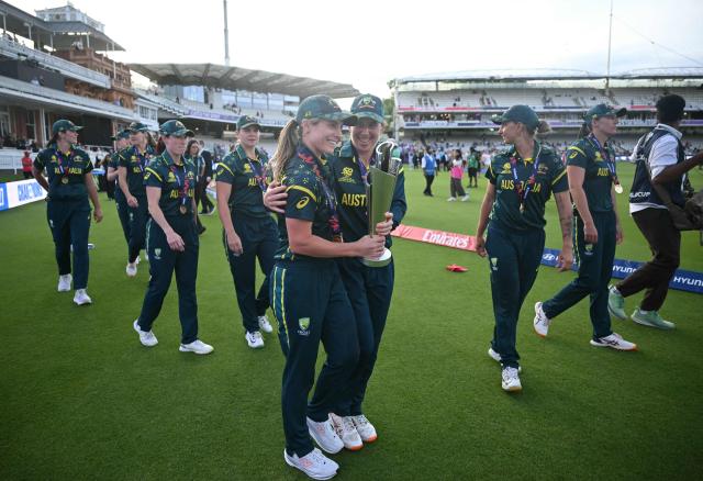 Australia's captain Sophie Molineux (centre left) with the trophy as Australia take a lap of honour after the ICC Women's T20 cricket world cup 2026 final between Australia and England, at Lord's in London on July 5, 2026. Australia thrashed England by seven wickets to win the Women's T20 World Cup final at Lord's on Sunday. Victory gave Australia a record-extending seventh Women's T20 global title as they chased down a target of 151 with 17 balls to spare. (Photo by JUSTIN TALLIS / AFP)