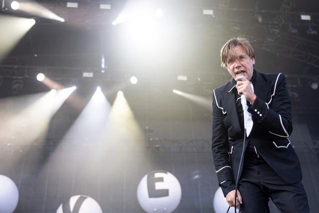 Howlin' Pelle Almqvist, lead singer of Swedish garage punk band The Hives, performs on stage on the last day of the 36th edition of the Eurockeennes de Belfort music festival in Sermamagny, eastern France on July 5, 2026. (Photo by ROMEO BOETZLE / AFP)