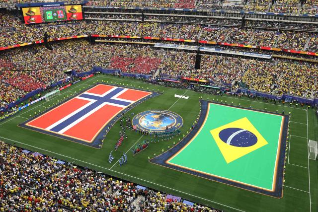 Norway and Brazil players enter the field ahead of the 2026 World Cup round of 16 football match between Brazil and Norway at the New York/New Jersey Stadium in East Rutherford on July 5, 2026.  (Photo by CHARLY TRIBALLEAU / AFP)