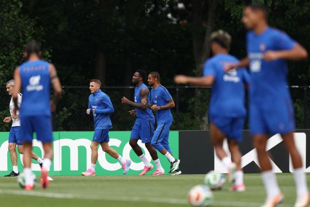 France's defender #03 Lucas Digne, France's forward #09 Marcus Thuram and France's forward #12 Bradley Barcola take part a training session at Bentley University in Waltham, near Boston, on July 5, 2026, during the 2026 World Cup football tournament. (Photo by FRANCK FIFE / AFP)