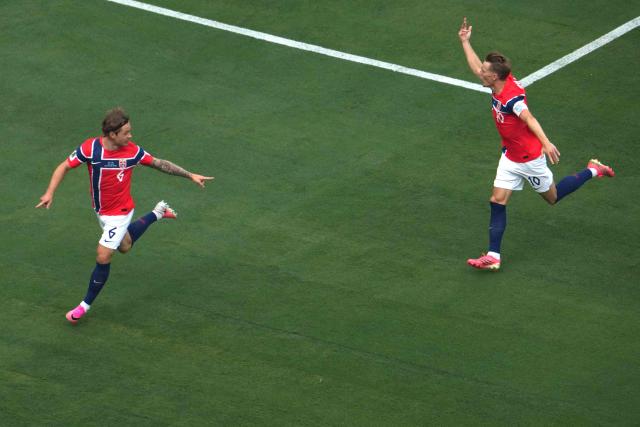 Norway's midfielder #06 Patrick Berg celebrates with teammate midfielder #10 Martin Odegaard after scoring a goal later disallowed by offisde during the 2026 World Cup round of 16 football match between Brazil and Norway at the New York/New Jersey Stadium in East Rutherford on July 5, 2026.  (Photo by TIMOTHY A. CLARY / AFP)