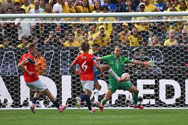 Brazil's midfielder #08 Bruno Guimaraes kicks the ball and misses a chance saved by Norway's goalkeeper #01 Orjan Nyland during the 2026 World Cup round of 16 football match between Brazil and Norway at the New York/New Jersey Stadium in East Rutherford on July 5, 2026.  (Photo by Jewel SAMAD / AFP)