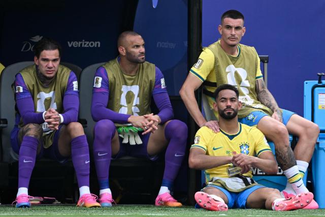 (From L) Brazil's goalkeeper #23 Ederson, Brazil's goalkeeper #12 Weverton, Brazil's defender #24 Roger Ibanez and Brazil's forward #09 Matheus Cunha (bottom) sit on the bench during the 2026 World Cup round of 16 football match between Brazil and Norway at the New York/New Jersey Stadium in East Rutherford on July 5, 2026.  (Photo by Pedro UGARTE / AFP)