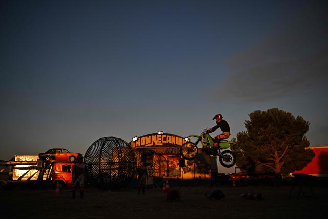 Stunt rider Bradley Cancy performs on his motorbike during the opening day of the summer season of the Show Mecanique Team in Serignan, southern France on July 5, 2026. (Photo by Gabriel BOUYS / AFP)