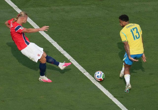 Norway's forward #09 Erling Braut Haaland shoots and scores his team's second goal during the 2026 World Cup round of 16 football match between Brazil and Norway at the New York/New Jersey Stadium in East Rutherford on July 5, 2026.  (Photo by TIMOTHY A. CLARY / AFP)