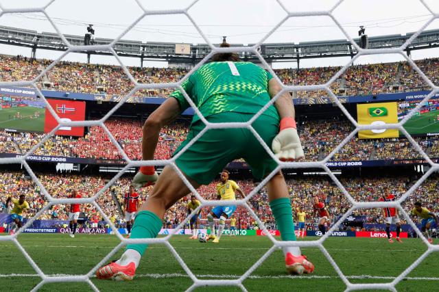 Brazil's forward #10 Neymar scores his team's first goal from the penalty spot past Brazil's goalkeeper #01 Alisson during the 2026 World Cup round of 16 football match between Brazil and Norway at the New York/New Jersey Stadium in East Rutherford on July 5, 2026.  (Photo by Odd ANDERSEN / AFP)