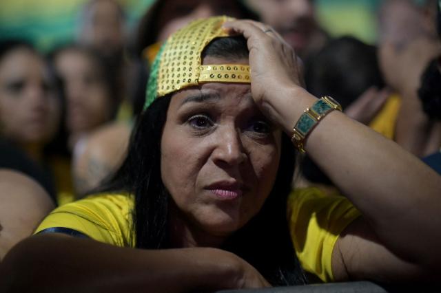A Brazilian fan reacts while watching the 2026 FIFA World Cup Round of 16 football match between Brazil and Norway during the Alzirao festival in the Tijuca neighborhood, North Zone of Rio de Janeiro, Brazil, on July 5, 2026. (Photo by TERCIO TEIXEIRA / AFP)
