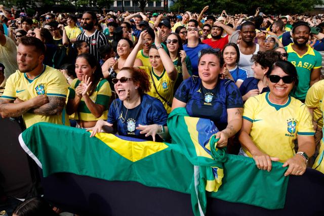 Brazilian fans react while watching the 2026 World Cup round of 16 football match between Brazil and Norway at a watch party in Hudson Yards Backyard in New York City on July 5, 2026. (Photo by Leonardo MUNOZ / AFP)