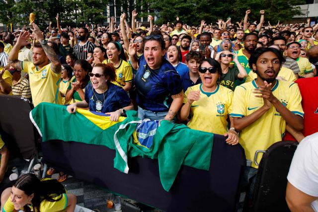 Brazilian fans react while watching the 2026 World Cup round of 16 football match between Brazil and Norway at a watch party in Hudson Yards Backyard in New York City on July 5, 2026. (Photo by Leonardo MUNOZ / AFP)