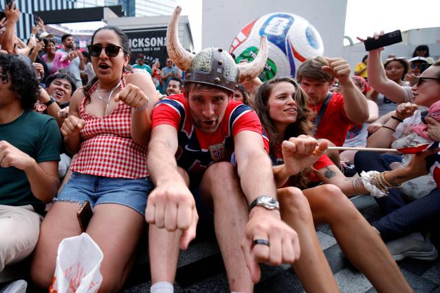 Norway's fans celebrate at the end the 2026 World Cup round of 16 football match between Brazil and Norway during a watch party at Hudson Yards Backyard in New York City on July 5, 2026. (Photo by Leonardo MUNOZ / AFP)