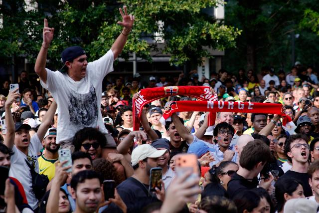 Norway's fans celebrate while watching the 2026 World Cup round of 16 football match between Brazil and Norway at a watch party in Hudson Yards Backyard in New York City on July 5, 2026. (Photo by Leonardo MUNOZ / AFP)