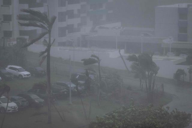 Strong wind brought by Super Typhoon Bavi hits Guam on July 6, 2026. (Photo by Yuichi YAMAZAKI / AFP)