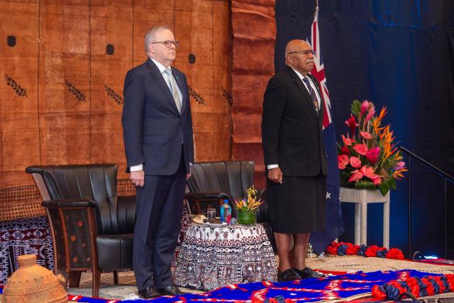 Australian Prime Minister Anthony Albanese (L) listens to the national anthems alongside Fiji's Prime Minister Sitiveni Rabuka during a traditional welcome ceremony at the Grand Pacific Hotel in Suva on July 6, 2026, as part of his official visit to Fiji aimed at strengthening the partnership between the two countries and regional cooperation in the Pacific. (Photo by Leon LORD / AFP)