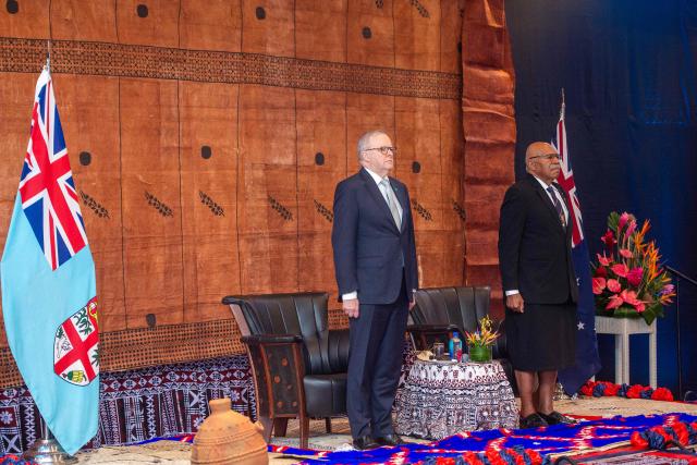 Australian Prime Minister Anthony Albanese (L) listens to the national anthems alongside Fiji's Prime Minister Sitiveni Rabuka during a traditional welcome ceremony at the Grand Pacific Hotel in Suva on July 6, 2026, as part of his official visit to Fiji aimed at strengthening the partnership between the two countries and regional cooperation in the Pacific. (Photo by Leon LORD / AFP)