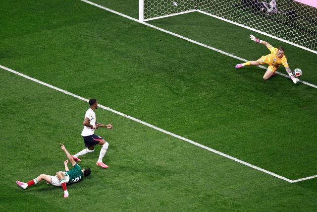 England's goalkeeper #01 Jordan Pickford makes a save after a shot by Mexico's forward #09 Raul Jimenez during the 2026 World Cup round of 16 football match between Mexico and England at the Mexico City Stadium in Mexico City on July 5, 2026.  (Photo by Ulises RUIZ / AFP)