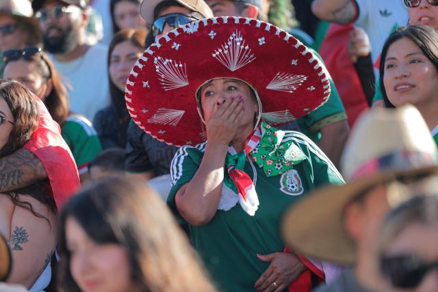 Mexico fans react after England scored as they watch the 2026 World Cup round of 16 football match between the Mexico and England during a watch party at Ace Mission Studios, in Los Angeles, California, on July 5, 2026. (Photo by Etienne LAURENT / AFP)