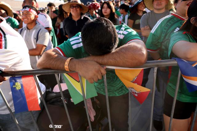 Mexico fans react after England scored as they watch the 2026 World Cup round of 16 football match between the Mexico and England during a watch party at Ace Mission Studios, in Los Angeles, California, on July 5, 2026. (Photo by Etienne Laurent / AFP)
