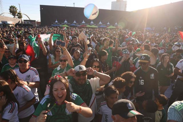 Mexico fans cheer after Mexico scored their first goal during the 2026 World Cup round of 16 football match between the Mexico and England at a watch party at Ace Mission Studios, in Los Angeles, California, on July 5, 2026. (Photo by Etienne Laurent / AFP)