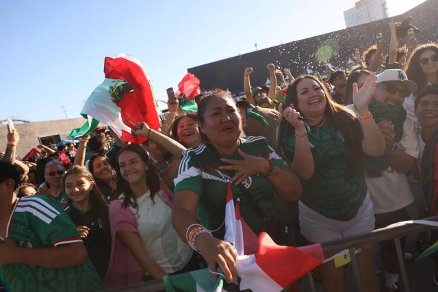Mexico fans cheer after Mexico scored their first goal during the 2026 World Cup round of 16 football match between the Mexico and England at a watch party at Ace Mission Studios, in Los Angeles, California, on July 5, 2026. (Photo by Etienne Laurent / AFP)