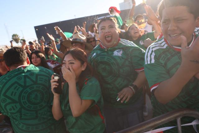 Mexico fans cheer after Mexico scored their first goal during the 2026 World Cup round of 16 football match between the Mexico and England at a watch party at Ace Mission Studios, in Los Angeles, California, on July 5, 2026. (Photo by Etienne Laurent / AFP)