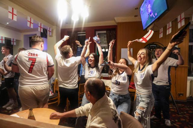 England's supporters celebrate a goal during the 2026 World Cup round of 16 football match between England and Mexico, at The Clock pub in Hebburn, north-east England early on July 6, 2026. (Photo by SCOTT HEPPELL / AFP)