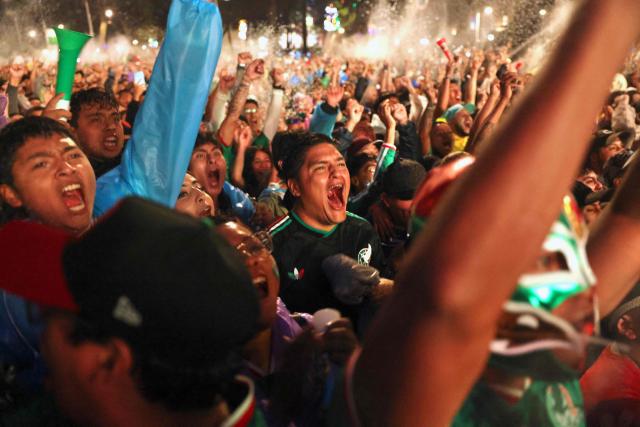 Mexican football fan react as they watch the 2026 FIFA World Cup Round of 16 football match between Mexico and England at the Angel of Independence in Mexico City on July 5, 2026. (Photo by Claudia Rosel / AFP)