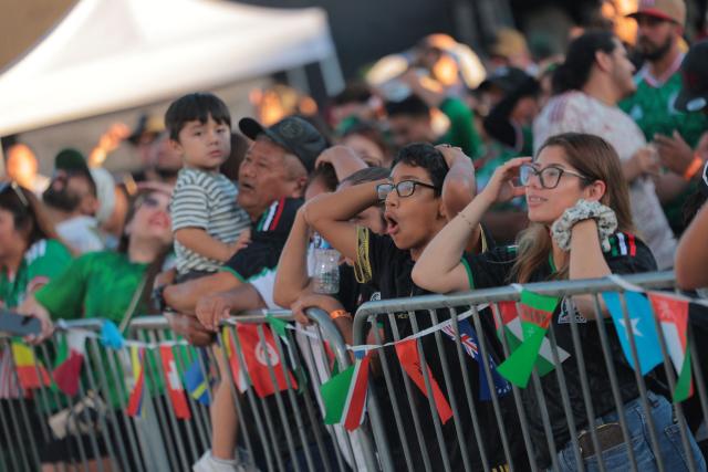 Mexico fans react after England scored their third goal during the 2026 World Cup round of 16 football match between the Mexico and England at a watch party at Ace Mission Studios, in Los Angeles, California, on July 5, 2026. (Photo by Etienne LAURENT / AFP)