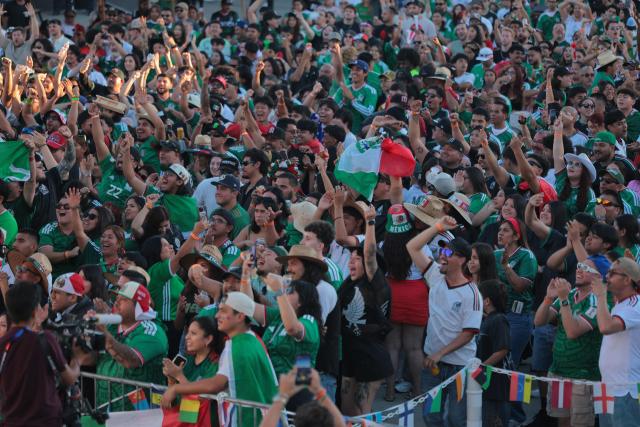 Mexico fans cheer as they watch the 2026 World Cup round of 16 football match between the Mexico and England at a watch party at Ace Mission Studios, in Los Angeles, California, on July 5, 2026. (Photo by Etienne LAURENT / AFP)