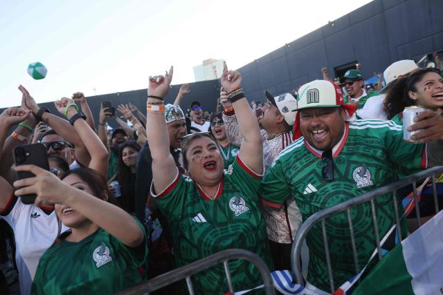 Mexico fans cheer after Mexico scored their second goal during the 2026 World Cup round of 16 football match between the Mexico and England at a watch party at Ace Mission Studios, in Los Angeles, California, on July 5, 2026. (Photo by Etienne Laurent / AFP)