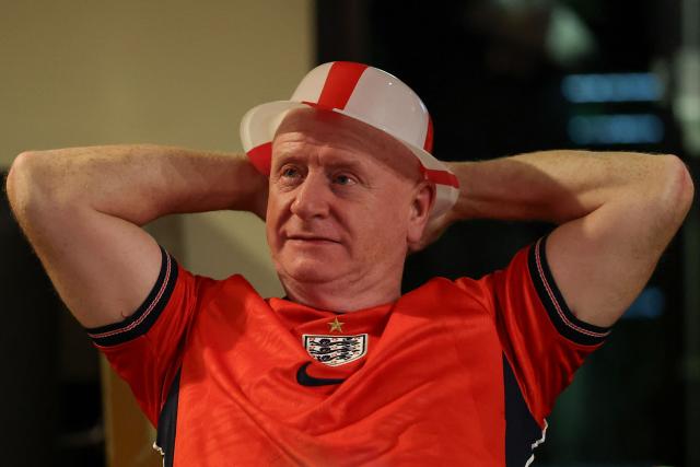 An England supporter watches the 2026 World Cup round of 16 football match between England and Mexico, at The Clock pub in Hebburn, north-east England early on July 6, 2026. (Photo by SCOTT HEPPELL / AFP)
