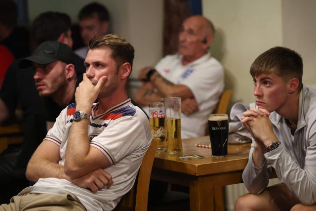 England's supporters watch the 2026 World Cup round of 16 football match between England and Mexico, at The Clock pub in Hebburn, north-east England early on July 6, 2026. (Photo by SCOTT HEPPELL / AFP)
