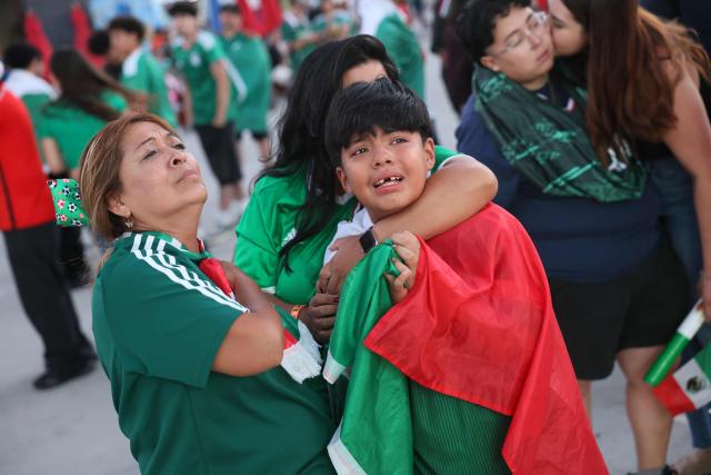 Mexico fans react after their team lost the 2026 World Cup round of 16 football match between the Mexico and England, at a watch party at Ace Mission Studios, in Los Angeles, California, on July 5, 2026. (Photo by Etienne Laurent / AFP)
