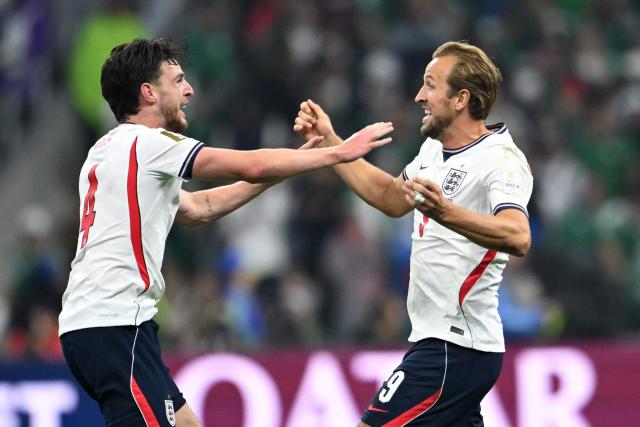 England's forward #09 Harry Kane (R) and midfielder #04 Declan Rice celebrate after winning the 2026 World Cup round of 16 football match between Mexico and England at the Mexico City Stadium in Mexico City on July 5, 2026.  (Photo by CARL DE SOUZA / AFP)