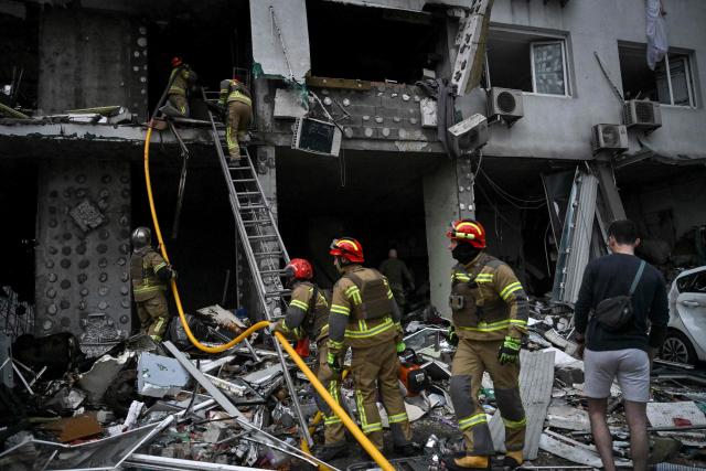 Rescuers work on a multistorey residential building damaged following a Russian missile strike on the Ukrainian capital of Kyiv on July 6, 2026, amid the Russian invasion in Ukraine. Russia struck Ukraine's Kyiv region with ballistic missiles on July 6, killing at least eight people and wounding dozens, authorities said, on the eve of a NATO summit in Turkey. (Photo by Genya Savilov / AFP)