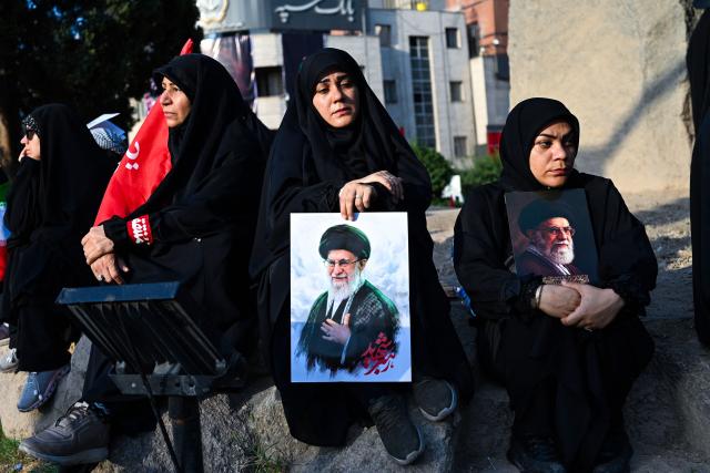 People gather at Ferdowsi Square for the funeral procession of Iran's slain Supreme Leader Ali Khamenei in Tehran July 6, 2026. Massive crowds are expected on July 6 for the funeral procession of late Iranian supreme leader Ali Khamenei in Tehran, with authorities hoping to avoid a repeat of the chaos that accompanied his predecessor's funeral. (Photo by Wakil Kohsar / AFP) / 