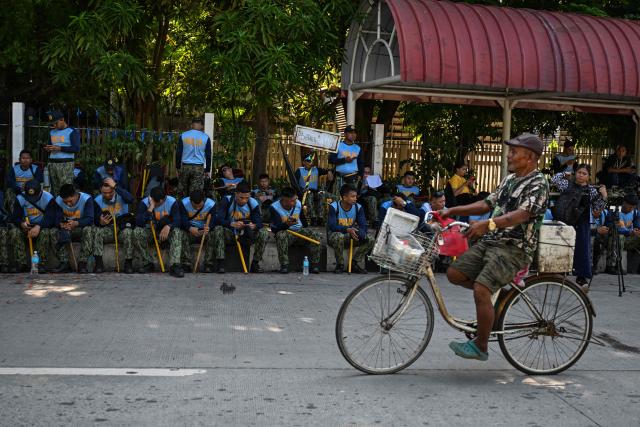 Police sit on standby outside the Senate of the Philippines in Pasay, Metro Manila on July 6, 2026. The Philippine Senate is set to open Vice President Sara Duterte's impeachment trial on July 6, with her political career -- and a planned 2028 presidential run -- in the balance. (Photo by Jam STA ROSA / AFP)