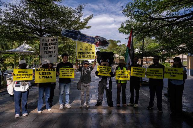 Malaysian NGOs display placards during the "No Rare Earth for Genocide" protest in Kuala Lumpur on July 6, 2026. The coalition urged the government to halt rare earth exports linked to military supply chains and strengthen transparency and environmental safeguards. (Photo by Mohd Rasfan / AFP)