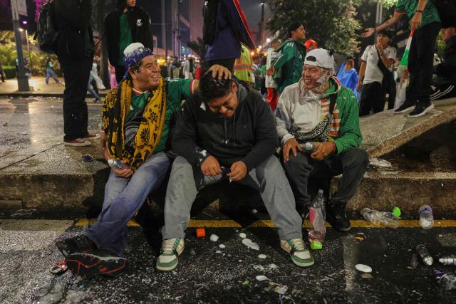 Mexican football fans react after the 2026 FIFA World Cup Round of 16 football match between Mexico and England at the Angel of Independence in Mexico City on July 5, 2026. (Photo by Claudia Rosel / AFP)