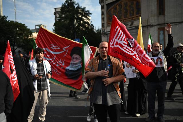 People gather at Ferdowsi Square for the funeral procession of Iran's slain Supreme Leader Ali Khamenei in Tehran July 6, 2026. Massive crowds are expected on July 6 for the funeral procession of late Iranian supreme leader Ali Khamenei in Tehran, with authorities hoping to avoid a repeat of the chaos that accompanied his predecessor's funeral. (Photo by Wakil Kohsar / AFP) / 