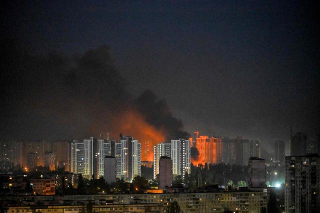 This photograph shows a fire after an explosion during a Russian missile strike on the Ukrainian capital of Kyiv on July 6, 2026, amid the Russian invasion in Ukraine. Russia struck Ukraine's Kyiv region with ballistic missiles on July 6, killing at least eight people and wounding dozens, authorities said, on the eve of a NATO summit in Turkey. (Photo by Eugene KOTENKO / AFP)