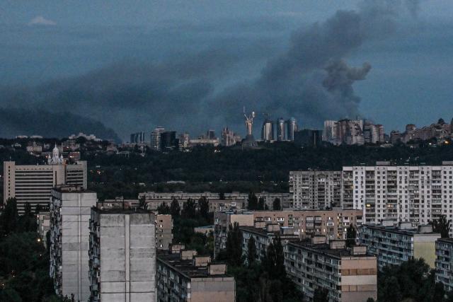 This photograph shows smoke rising after an explosion during a Russian missile strike on the Ukrainian capital of Kyiv on July 6, 2026, amid the Russian invasion in Ukraine. Russia struck Ukraine's Kyiv region with ballistic missiles on July 6, killing at least eight people and wounding dozens, authorities said, on the eve of a NATO summit in Turkey. (Photo by Eugene KOTENKO / AFP)