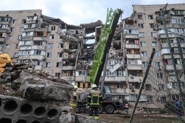 Rescuers work on a residential building partially destroyed as a result of Russian missile strike on the Ukrainian capital of Kyiv on July 6, 2026, amid the Russian invasion in Ukraine. The death toll from Russian bombardment on the Kyiv region on July 6, has risen from eight to 10, authorities said, warning the number could rise further. (Photo by Serhii Okunev / AFP)