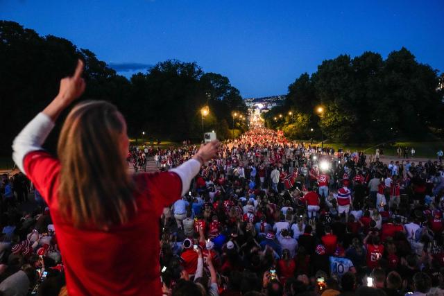 Norwegian supporters celebrate after the victory of their team in the 2026 World Cup round of 16 football match between Brazil and Norway, at Slottsplånse and Karl Johans gate in Oslo on July 5, 2026. (Photo by Javad Parsa / NTB / AFP) / Norway OUT