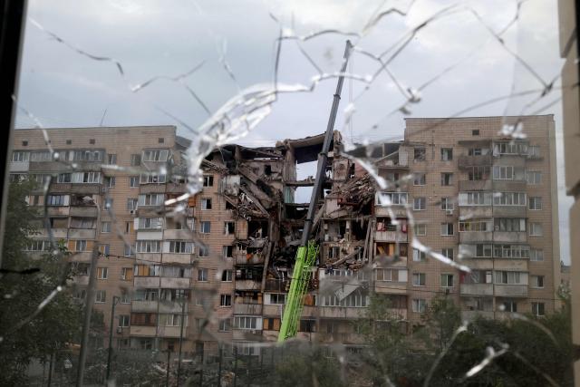 This photograph shows a multistorey residential building partially destroyed as a result of Russian missile strike on the Ukrainian capital of Kyiv on July 6, 2026, amid the Russian invasion in Ukraine. Russia struck Kyiv's capital region with ballistic missiles on Monday, sparking fires and killing at least four people, authorities said, on the eve of a NATO summit in Ankara. (Photo by Serhii Okunev / AFP)