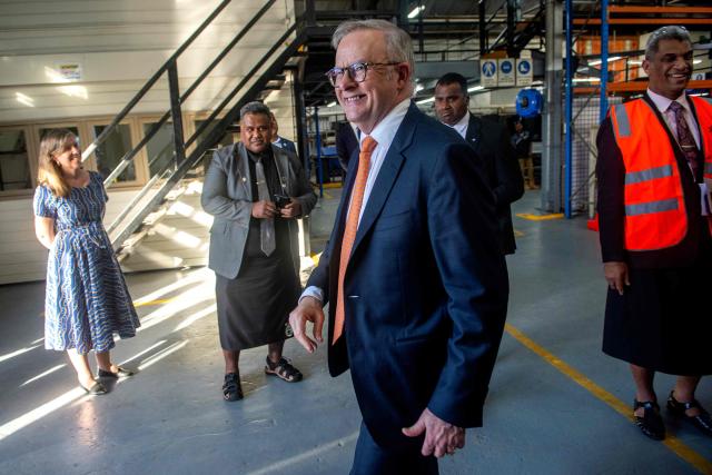 Australian Prime Minister Anthony Albanese (C) tours the Vuvale Skills hub after it's opening in Suva on July 6, 2026. Australia signed a new defence alliance with Fiji on July 6, bolstering ties with its South Pacific island neighbor as it seeks to outmanoeuvre China in the region. (Photo by LEON LORD / AFP)