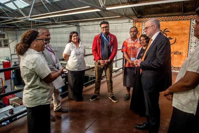 Australian Prime Minister Anthony Albanese (R) tours the Vuvale Skills hub after it's opening in Suva on July 6, 2026. Australia signed a new defence alliance with Fiji on July 6, bolstering ties with its South Pacific island neighbor as it seeks to outmanoeuvre China in the region. (Photo by LEON LORD / AFP)
