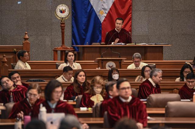 Philippine Senate President Sherwin Gatchalian (top) looks on during the start of the impeachment trial of Philippine Vice President Sara Duterte at the Philippine Senate in Pasay, Metro Manila on July 6, 2026. The Philippine Senate opened Vice President Sara Duterte's impeachment trial on July 6, with her political career -- and a planned 2028 presidential run -- in the balance. (Photo by NOEL CELIS / POOL / AFP)